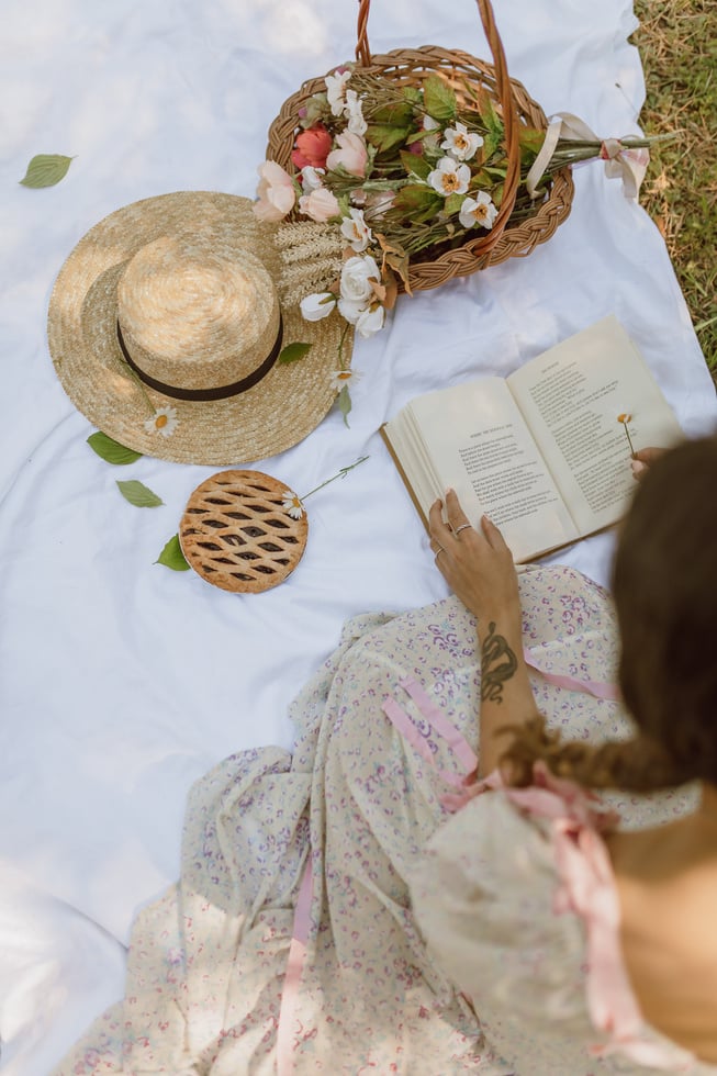 Woman Reading a Book in the Garden